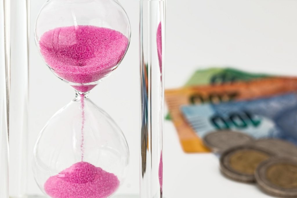 Hourglass, money, time — "How 7 Seater Car Hire Provides Comfort and Flexibility for Group Travel"