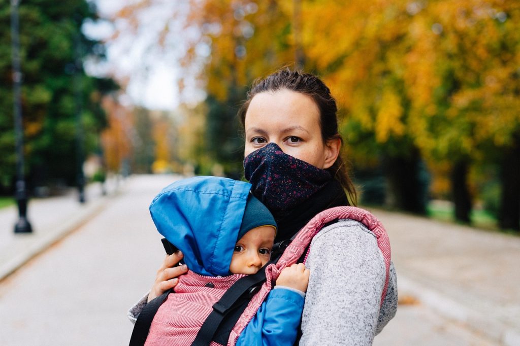 Woman, child, face mask — How Dr. Eric Haeger Supports Chronic Condition Management